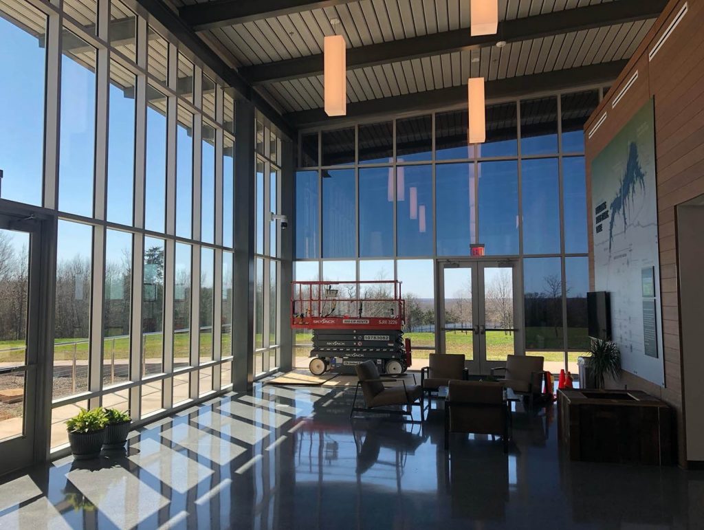 commercial building with rooms full on windows that are tinted