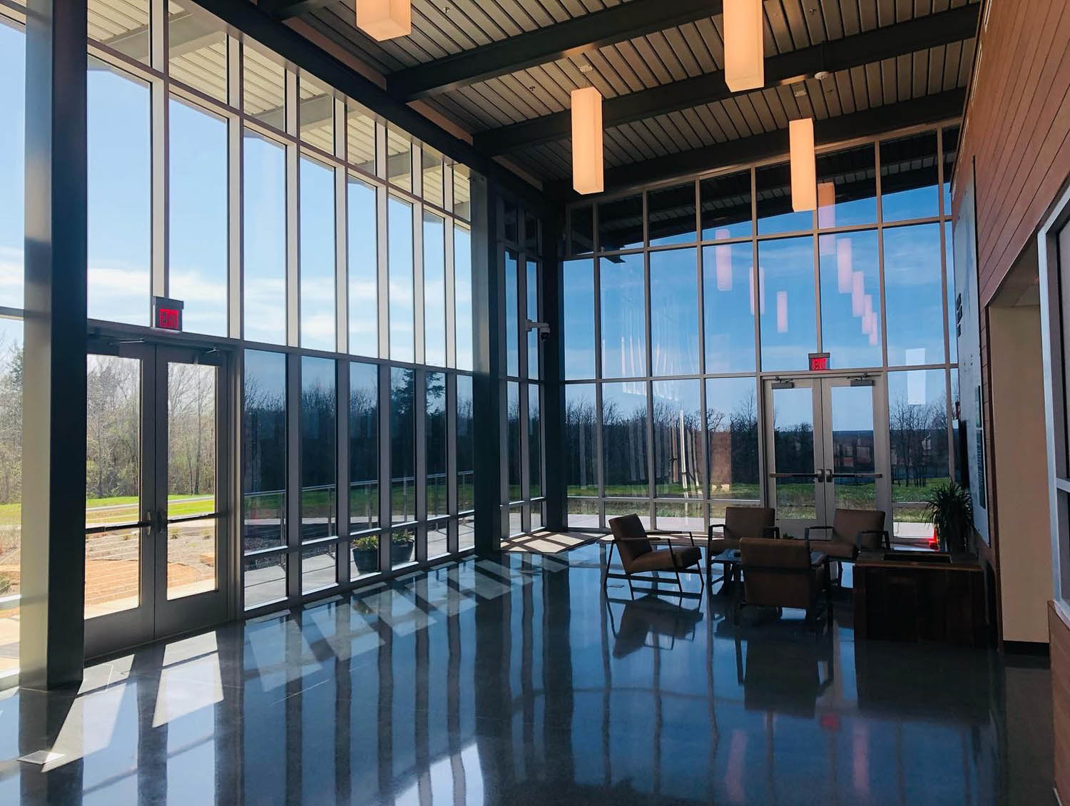 commercial building room with walls of windows all tinted